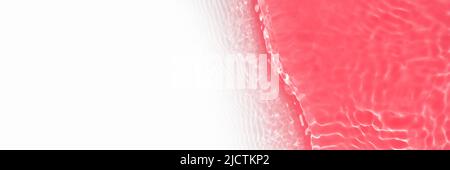 Surface of toned in red swimming pool water with light reflection and waves. Texture of transparent blue water with waves in swimming pool. Trendy Stock Photo