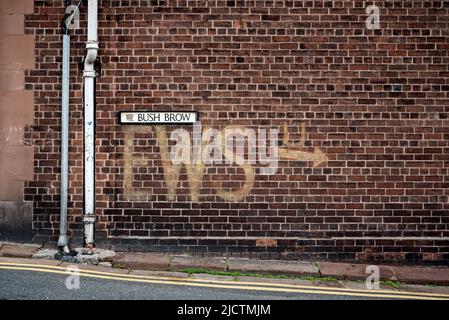 Ghost Sign from World War Two pointing to the Emergency Water Supply for dealing with fires and incendiary bombs. Carlisle, Cumbria, England, UK. Stock Photo