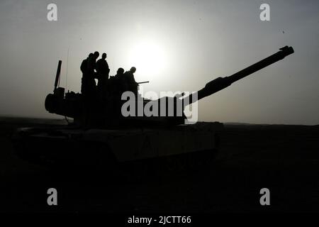 U.S. Marines with 1st Tank Battalion, 1st Marine Expeditionary Force Forward, inspect their M1 Abrams Battle Tank outside Camp Delaram II in the Nimro Stock Photo