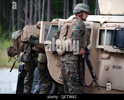 U.S. Marines with 1st Battalion, 8th Marine Regiment (1/8), 2D Marine Division, loads a wounded  Marine into a High Mobility Multipurpose Wheeled Vehi Stock Photo