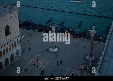 Gondolas along the Doge’s palace and Piazzetta San Marco, the view from Campanile di San Marco late in the evening, Venice, Italy Stock Photo