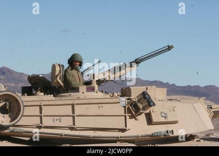 U.S. Marines with 2D Tank Battalion attached to 1st Battalion, 8th Marine Regiment (1/8), 2D Marine Division, drive their M1A1 Abrams Tank towards a t Stock Photo