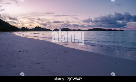 Praslin Seychelles tropical island with withe beaches and palm trees, the beach of Anse Volbert Seychelles.  Stock Photo