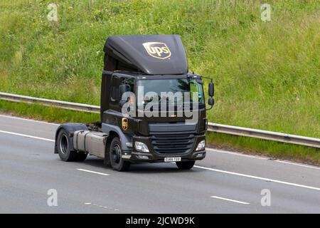 UPS DAF Trucks, 400 FT brown tractor unit 10837cc Diesel lorry; driving on the M6 Motorway, UK Stock Photo