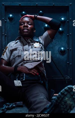 ALEXIS LOUDER in COPSHOP (2021), directed by JOE CARNAHAN. Credit