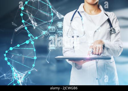 Bioengineering and medical education concept with female doctor in in white medical gown coat using digital tablet and virtual screen with human helix Stock Photo