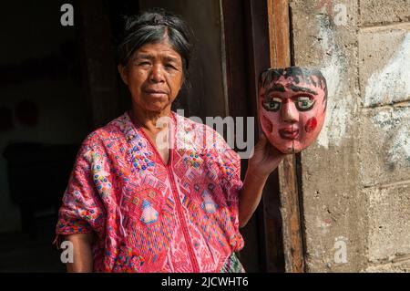 Mayan woman w/ dance mask in Nahuala, Solola Department, Western Highlands, Guatemala, Central America. © Kraig Lieb Stock Photo