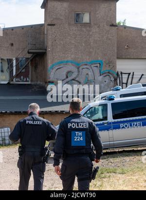 Gotha, Germany. 16th June, 2022. Police officers search a factory building during a raid. With a large contingent, police searched a total of 26 residential and business premises in Thuringia, Schleswig-Holstein and Berlin on Thursday. According to the Thuringian State Criminal Police Office (TLKA), more than 500 officers from Thuringia and special forces from other federal states were deployed. Suspicion exists because of the trade with narcotics in connection with money laundering as well as offence against the weapon law. Credit: Michael Reichel/dpa-Zentralbild/dpa/Alamy Live News