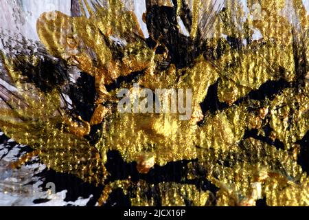 Abstract gold texture of acrylic paint on wall as background, selective focus. Stock Photo