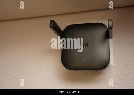 15 August 2021 Eskisehir Turkey. Xiaomi wifi extender plugged in at home close up view Stock Photo