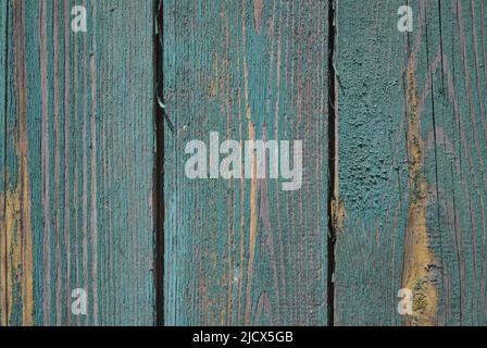 background old gray wood with shabby paint, with gaps between boards, knots. Weathered and faded natural wood with lines of boards Stock Photo