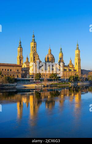 View of the Basilica of Our Lady of the Pillar reflected in Ebro River, Zaragoza, Aragon, Spain, Europe Stock Photo