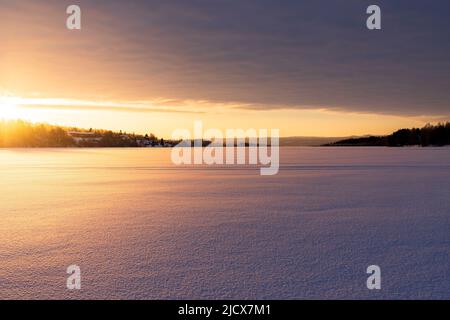 Arctic sunrise over the frozen landscape covered with snow in winter, Harads, Lapland, Sweden, Scandinavia, Europe Stock Photo
