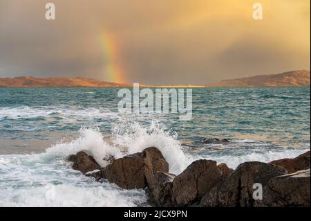 Coastal view with rainbow with crashing waves, Isle of Lewis and Harris, Outer Hebrides, Scotland, United Kingdom, Europe Stock Photo
