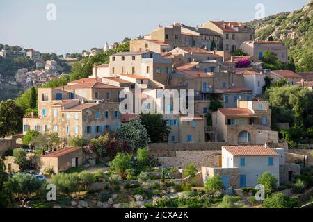 Village houses perched on steep hillside, Corbara in background, Pigna, L'Ile-Rousse Balagne, Haute-Corse, Corsica, France, Mediterranean, Europe Stock Photo