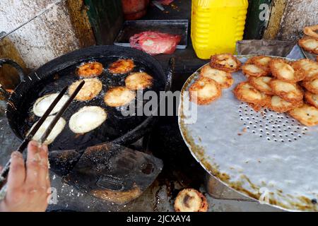 Traditional Nepalese restaurant, fried Sel Roti, the traditional breakfast for Nepali people, Kathmandu, Nepal, Asia Stock Photo