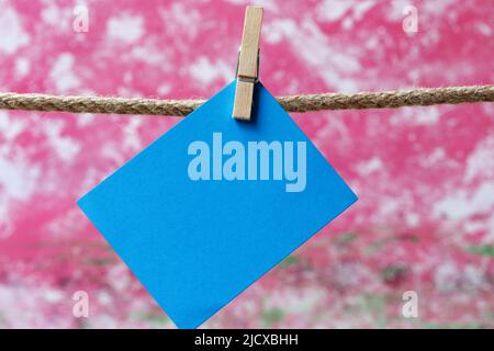 Note paper hanging on clothesline Stock Photo