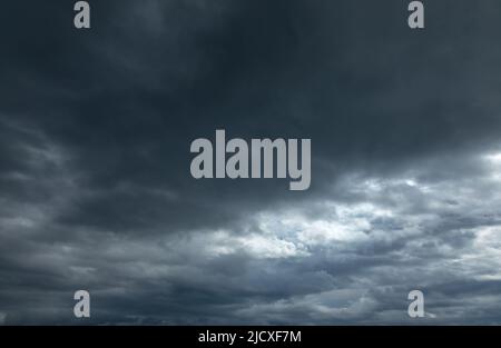 Dramatic sky with dark stormy clouds before thunderstorm natural background Stock Photo