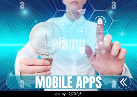 Handwriting text Mobile Apps. Word Written on small programs are made to work on phones like app store or app store Lady holding light bulb pointing Stock Photo