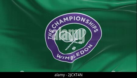 London, UK, April 2022: Close up of The Championships Wimbledon flag waving in the wind. Wimbledon Championships is a major tennis tournament schedule Stock Photo