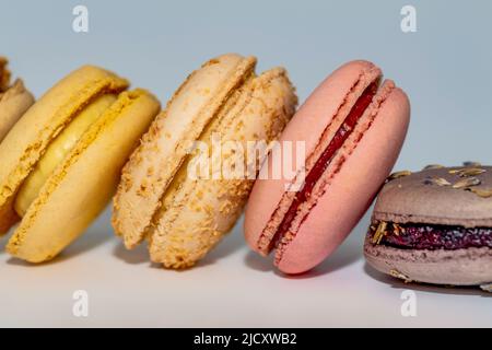 Row of delicious colorful French macaroons of different flavors, background, panoramic shot Stock Photo