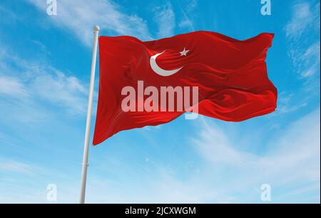 official flag of Islamic State Indonesia at cloudy sky background on sunset, panoramic view. Indonesian travel and patriot concept. copy space for wid Stock Photo