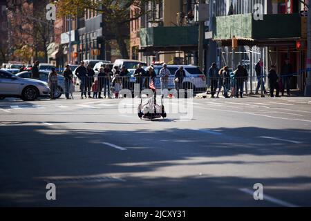 Brooklyn, New York,USA - November 3. 2019: Wheelchair athlete with USA flag on wheelchair racing at the NYC Marathon. Stock Photo
