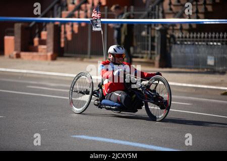Brooklyn, New York,USA - November 3. 2019: Wheelchair athlete racing at the NYC Marathon. Disabled athlete on wheelchair Stock Photo