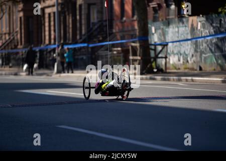 Brooklyn, New York,USA - November 3. 2019: Wheelchair athlete racing at the NYC Marathon. Disabled athlete on wheelchair Stock Photo