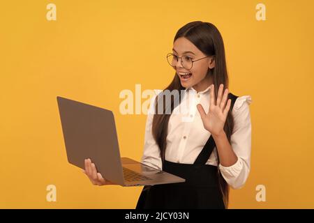 impact of computer on vision. kid in glasses. teen girl use laptop for communication. Stock Photo