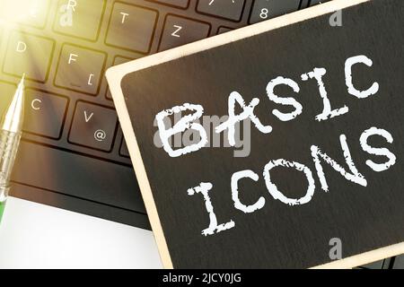 Handwriting text Basic Icons. Word for pictogram or ideogram displayed on a computer screen or phone Computer Keyboard And Symbol.Information Medium Stock Photo