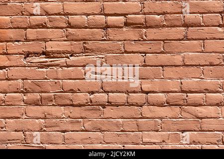 old red ochre painted clean brick wall as harmonic background Stock Photo