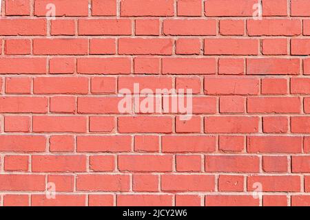 old red ochre painted clean brick wall as harmonic background Stock Photo