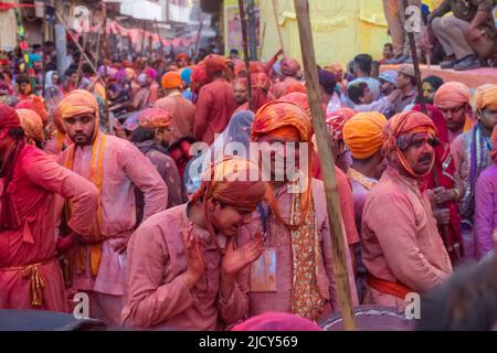 Barsana, India - March 2022: Portrait on Indian people with color on face celebrating the colorful holi festival on the streets of barsana. Stock Photo