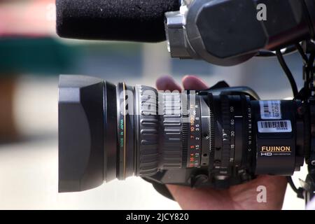 TV professional video camera lens - detail. Manual focusing. Stock Photo