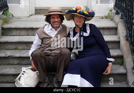 People take a rest on steps in Dublin's city centre as Bloomsday celebrations continue. Bloomsday is a celebration of the life of Irish writer James Joyce, observed annually worldwide on June 16, the day his 1922 novel Ulysses takes place in 1904, the date of his first outing with his wife-to-be Nora Barnacle. The day is named after its protagonist Leopold Bloom. Picture date: Thursday June 16, 2022. Stock Photo