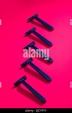 Abstract still life with razors on a colored background Stock Photo - Alamy