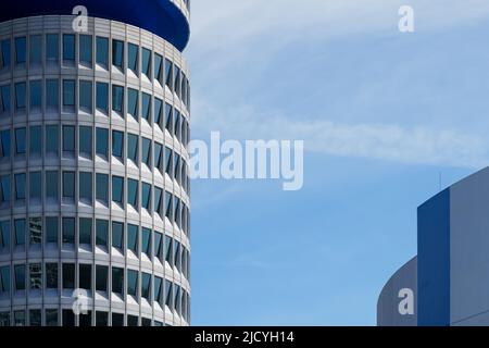 The BMW Tower, the BMW four-cylinder is the main administration building and landmark of the car manufacturer BMW in Munich, Germany, 12.4.22 Stock Photo