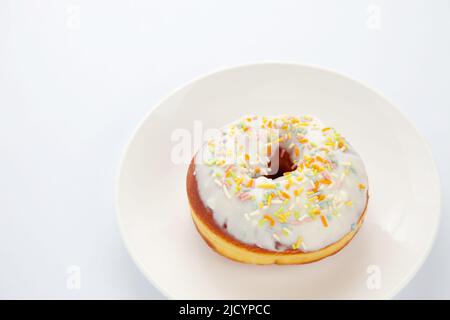 frosted doughnut isolated on white background Stock Photo