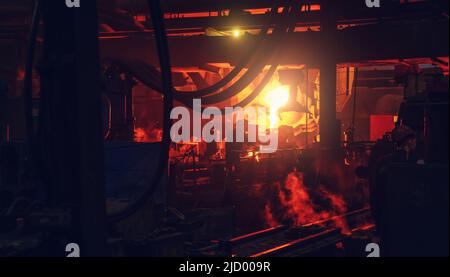 Steel mill for iron pipes or tubes for water production. Metallurgy foundry factory interior. Stock Photo
