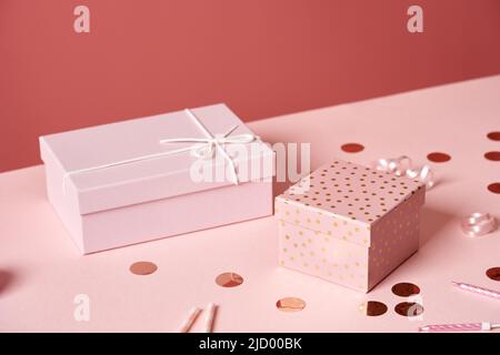 Pink gift boxes on a table - birthay celebration concept Stock Photo