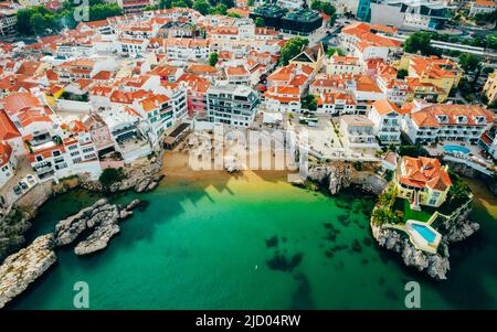 Drone aerial view of Praia da Rainha and historic city centre of Cascais, Portugal Stock Photo