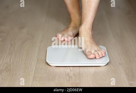Fat Man Standing On Electronic Scales Conceptual Photo Of Weight Loss Isolated On White Stock Photo Alamy