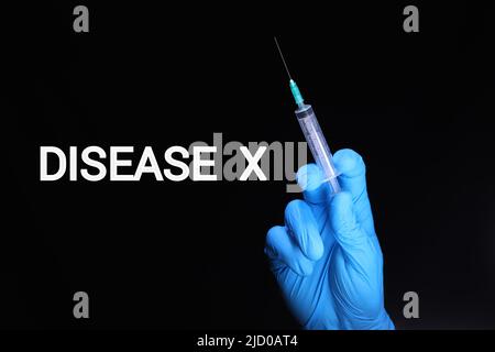 Conceptual image of Disease X represented as an emerging viral threat beside a hand holding a sterile syringe, symbolizing vaccination Stock Photo