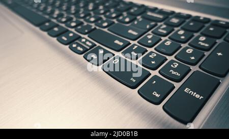 Side view of modern laptop keyboard, selective focus Stock Photo