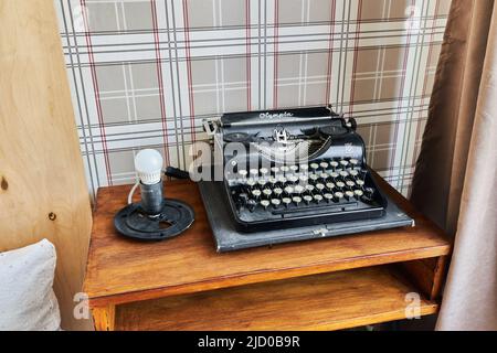 The typewriter is on the old table  Stock Photo