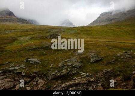 Moody mountains hidden with clouds around Viterskallet hut on Kungsleden hiking trail, July, Lapland, Sweden Stock Photo