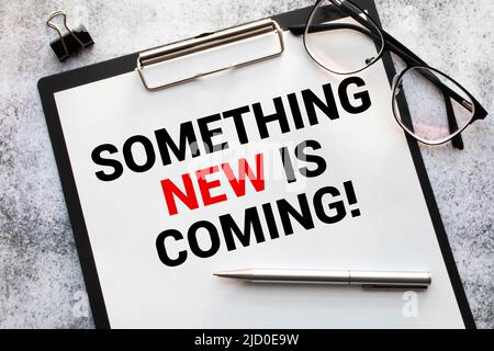 Something new is coming. Business concept. text on white notepad paper Stock Photo