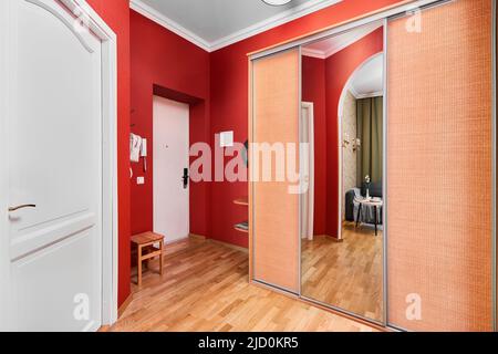 Photo of a stylish hallway with red walls  Stock Photo
