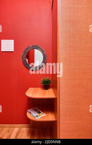 Photo of a stylish hallway with red walls  Stock Photo